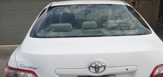 2009 Toyota Camry, 4-cylinder engine, white, clean title.
