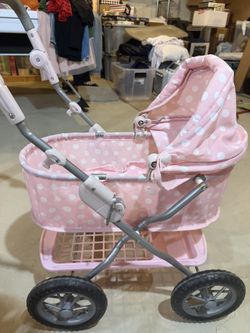 a light pink polka-dotted doll pram Stroller potterybarnkids