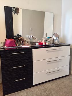 Very quality dresser& mirror by Ashley furniture