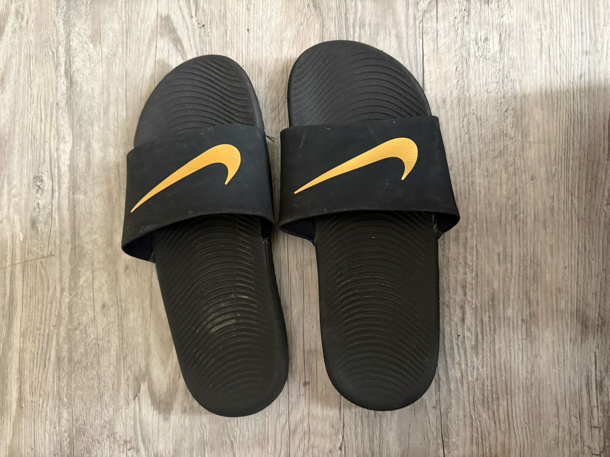 Nike , Gold and black slides size 6.5