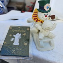 Snow babies and frosty figurine