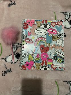 Notebook and pink pen