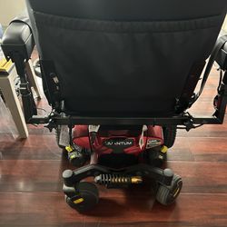 A Brand New 20 Inch Wide Red Jazzy Motorized Wheelchair.