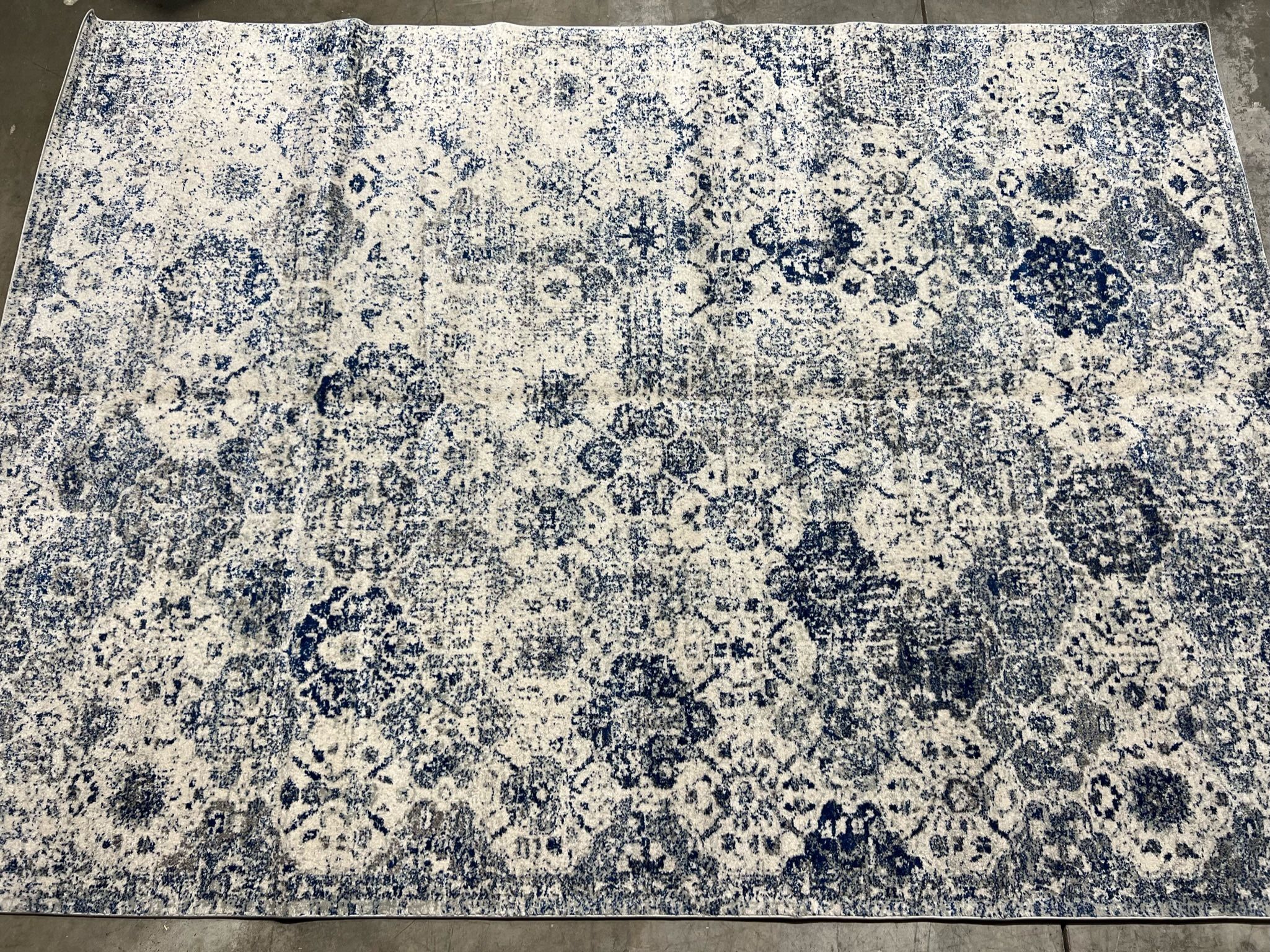 {ONE} Harty oriental white/royal blue area rug - 9’ x 12’ rectangle. Material: polypropylene. MSRP: $275. Our price: $178 + Sales tax