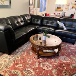 Black Leather Sectional With ottoman 