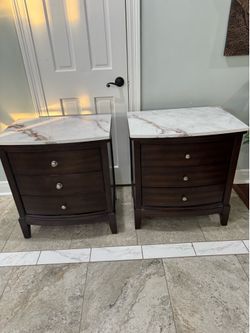 Two sturdy wood with real top marbles nightstand good condition