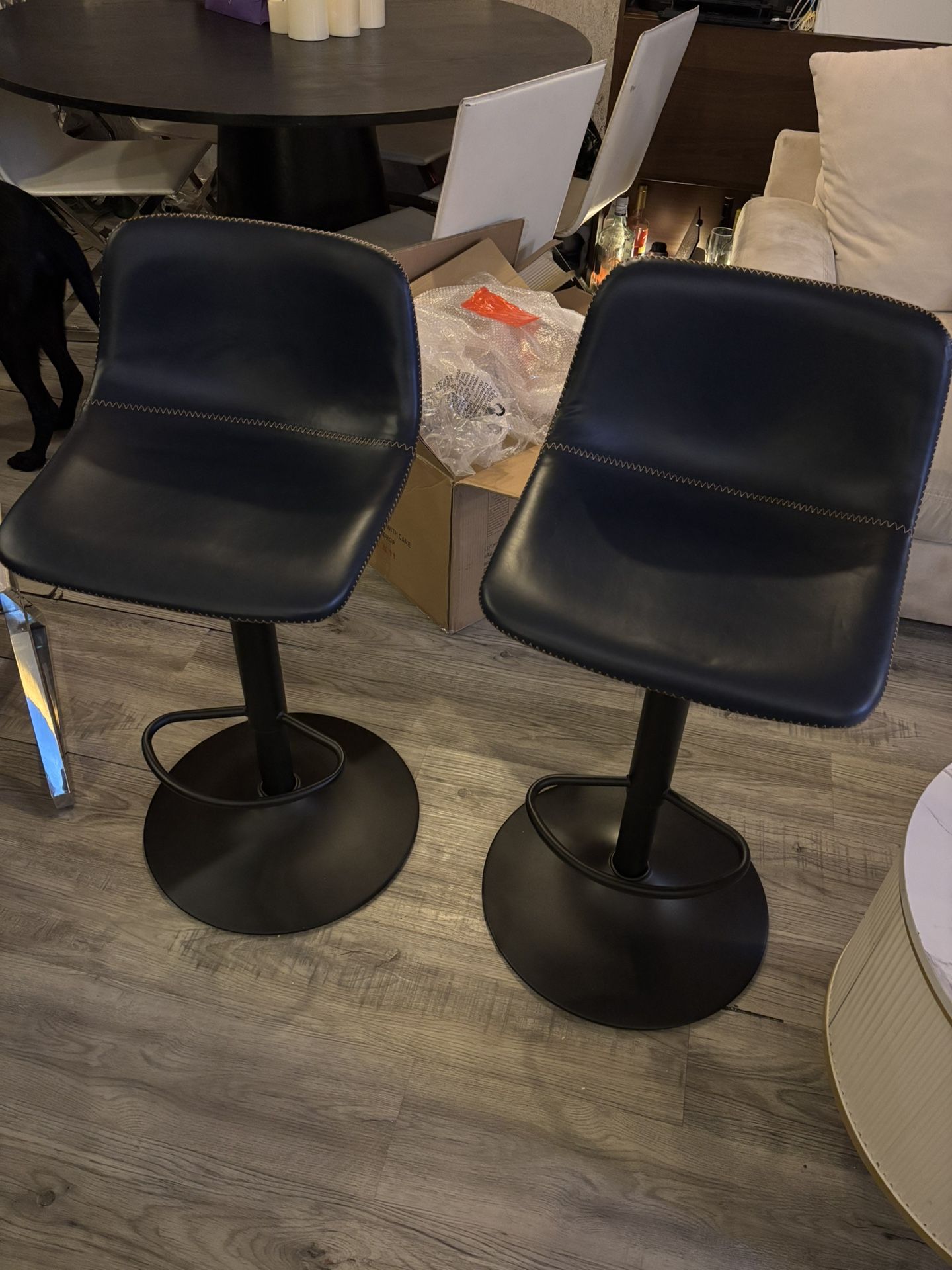 Swivel leather adjustable height bar and counter stools.