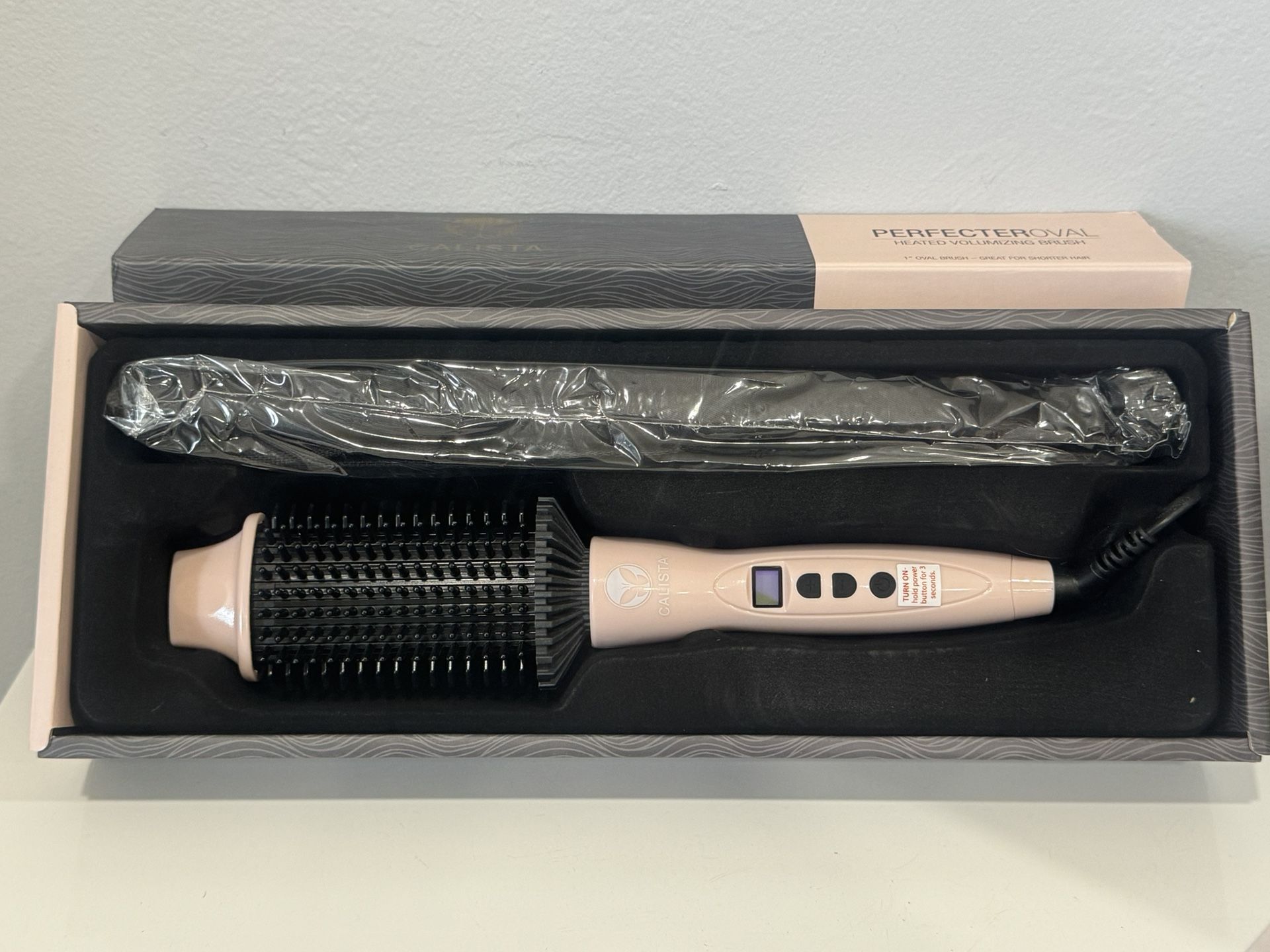 this is an amazing “Perfecteroval” a heated hair styler. Calista PerfecterOval Heated Volumizing Brush (Pink) 1  main image 2