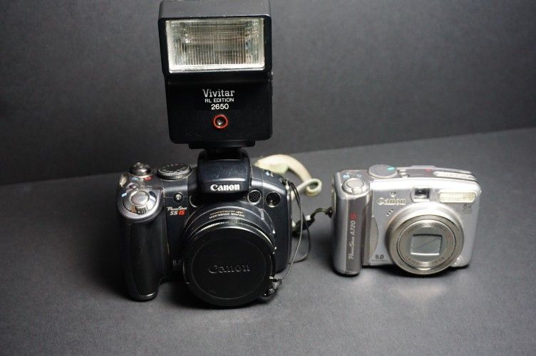 2 Canon Cameras With Flash