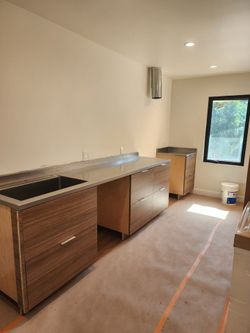 Stainless steel countertop with integrated sink w/ accessory rail