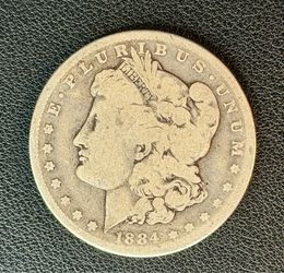 1884 Morgan Silver Dollar $1 90% Silver U.S. Coin Better Date Collector Coin  Condition: Circulated. Heavy wear from circulation with visible date and