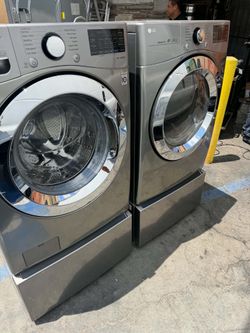 LG front load washer and dryer with pedestal stainless steel