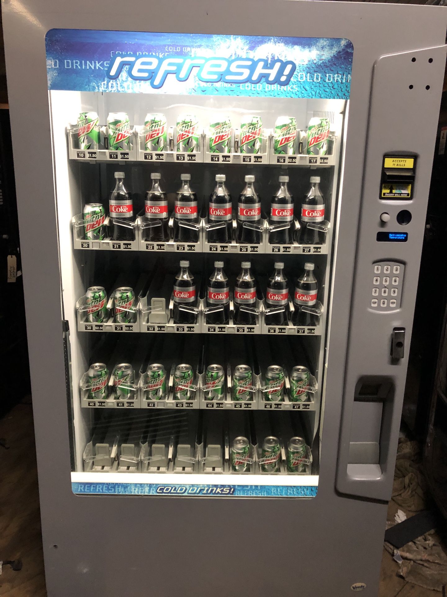 Vendo Vue 40 glass front vending machine. Monthly special with warranty.