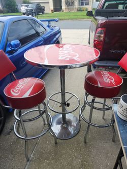Coca cola table with 2 stools  $550 or make offer