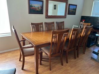 Dining table and chairs with removable leaf