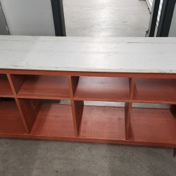 Long shelf with 8 openings for storage 
