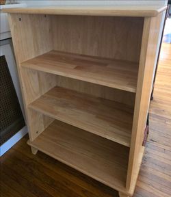 Solid wood bookshelf $30. Pick-up In Aurora.