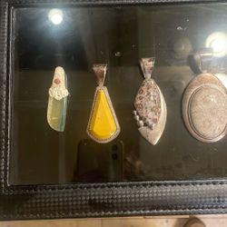 Silver and gym pendants