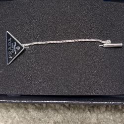 Prada brooch