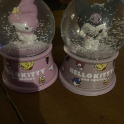 Two purple and pink Sanrio characters Rq