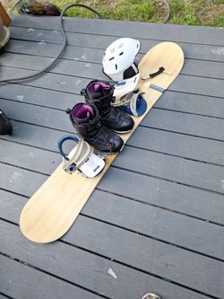 154cm burton Snowboard. Rixi boa boots womens 9 and helmet