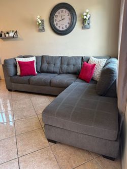 Like new gray living spaces sectional couch !!
