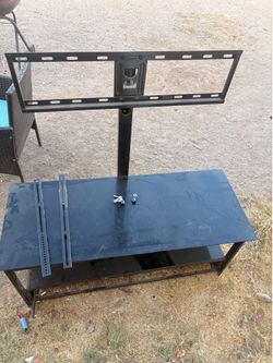 TV stand/entertainment center with an integrated TV mount