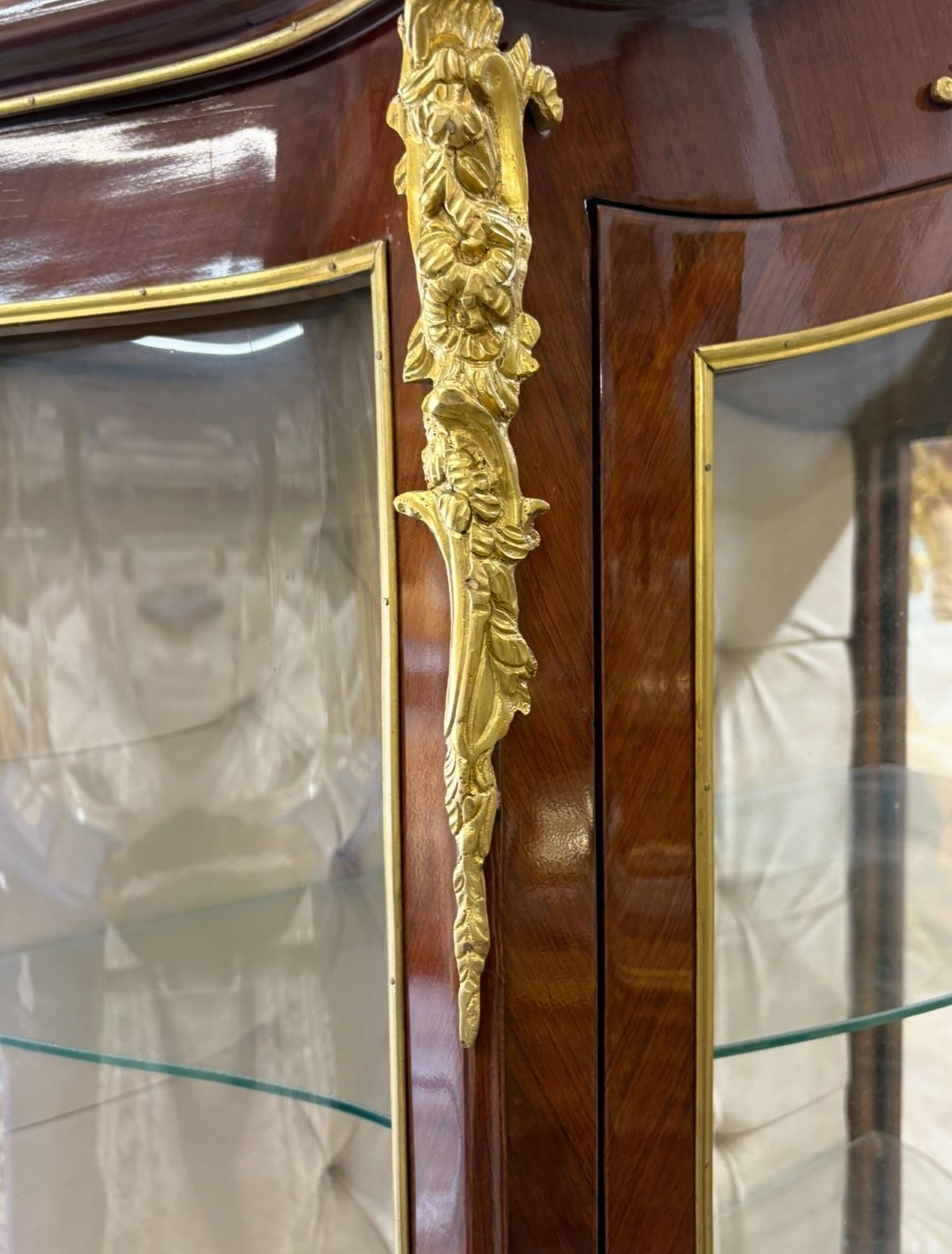 Curio Louis XVI Vitrine LOOK UP This is a Louis XVI style vitrine. TIME PERIOD Late 20th Century ORIGIN France HISTORY This vitrine is crafted in the