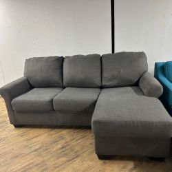 Delivery Available Ashley dark gray sofa couch w reversible chaise