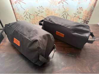 2 collapsible camping chairs and tables