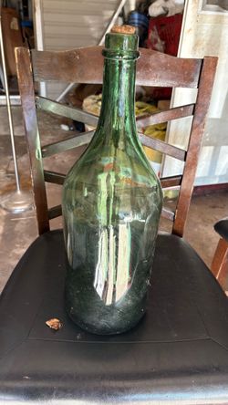 18” tall by 5” vintage wide Green Glass bottle with cork.