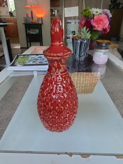 Red ceramic jar with lid