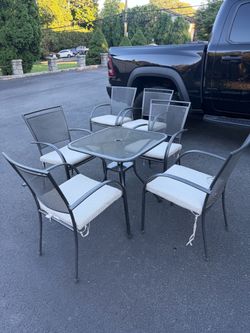 Bistro table plus 6 chairs and cushions