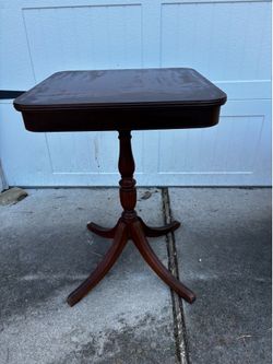 Dark wood pedestal table