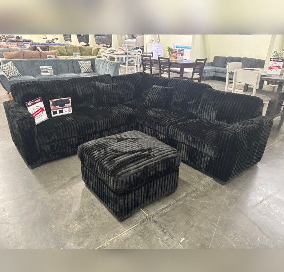 Black jumbo corduroy sectional sofa with ottoman 