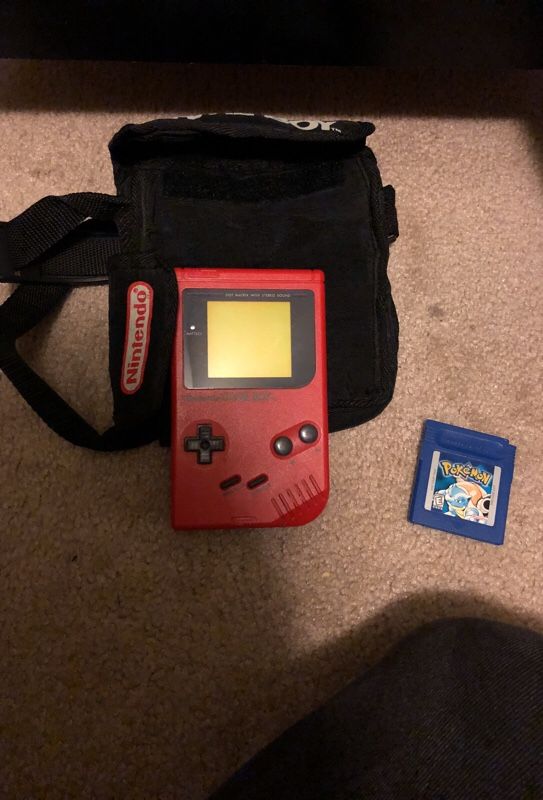 Nintendo gameboy with case and Pokémon blue