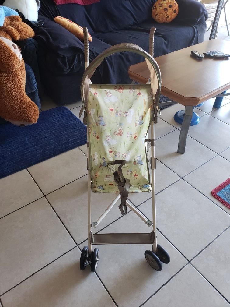 Disney umbrella stroller winnie the poo with Sun shield very good condition folds everything working