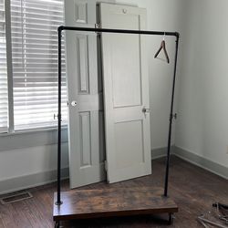 Rolling coat rack
