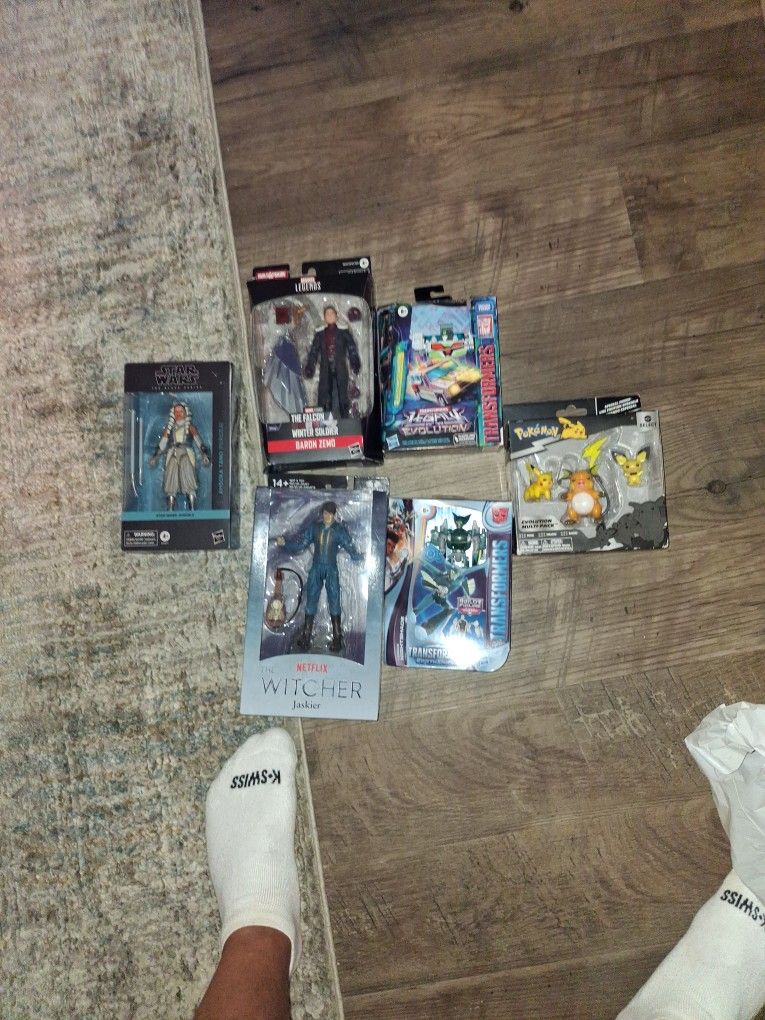 Pokémon  Evolution Multi Pack transformers Earth Spark. Net Flix. Witcher Jaskier. Star Wars Ansoka Marvel Legends  The Falccon Winter Soldier. And Tr