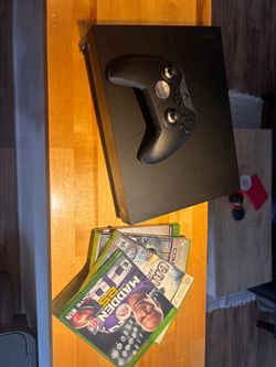 X Box One X + controller, cords, 4 games