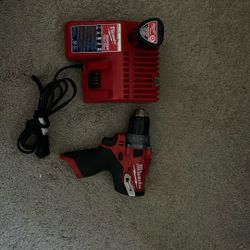 Use Milwaukee 12  bolts  Drill With Battery And.V  12/18 V Charger