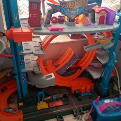 Hot Wheels Storage Full Of Tracks, A Table And A Parking Garage 