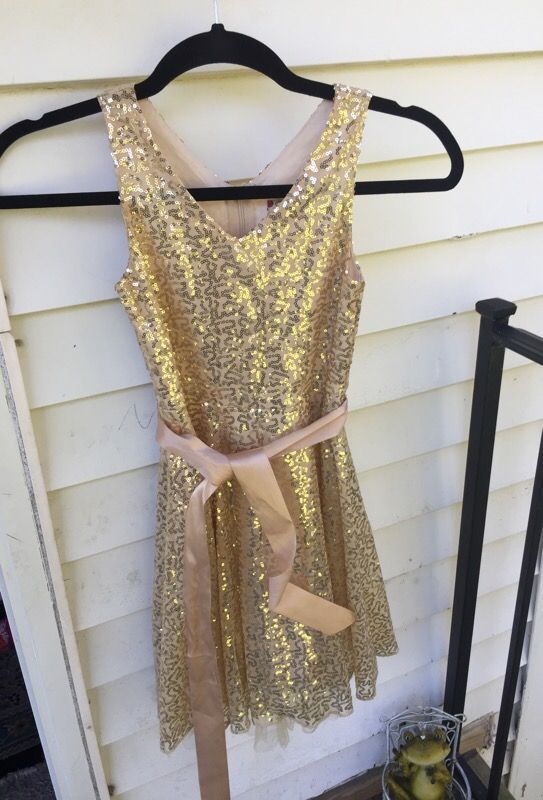 Two gold sequins dresses