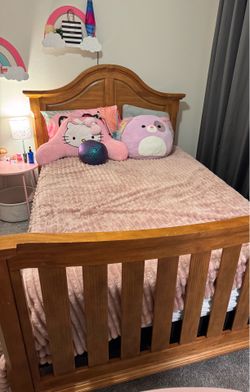 Full size bed with headboard, footboard, mattress, and matching dresser