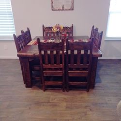 Rustic Dining Table With Eight Chairs.