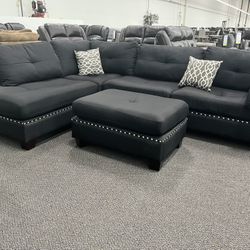 New Reversible Sectional .  Black .  104” X 75”.  Free Delivery !