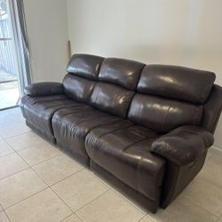 Brown faux leather sofa