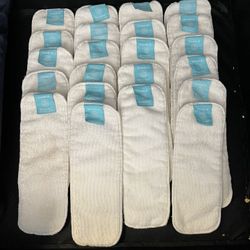 Charlie banana Clothe Diapers  7 clothe diapers - may need elastic replacement  22 extra reusable inserts  Lots of baby items available and not posted