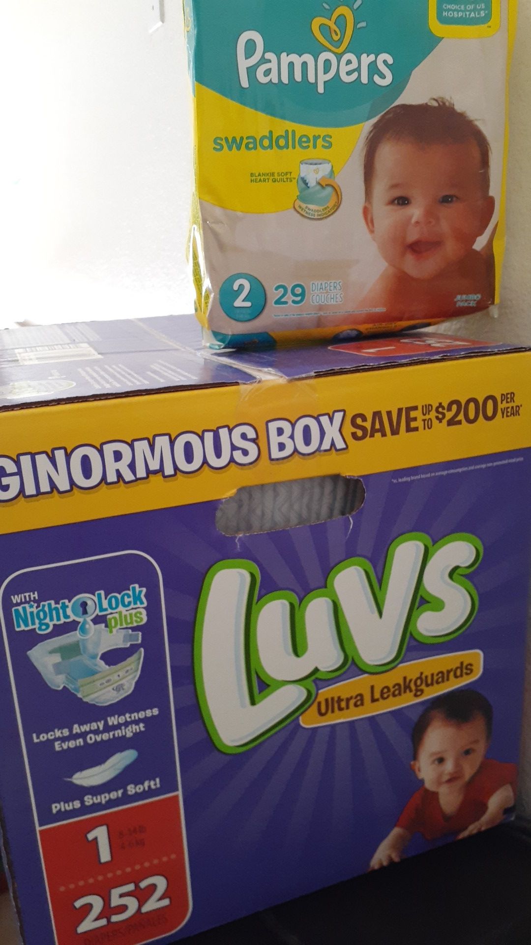 New Luvs Ginormous box and Pampers soft pack size 1 and 2