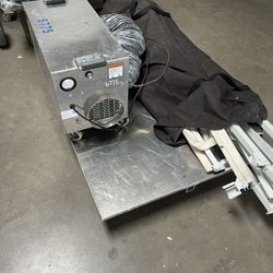 Dust containment unit with air scrubber